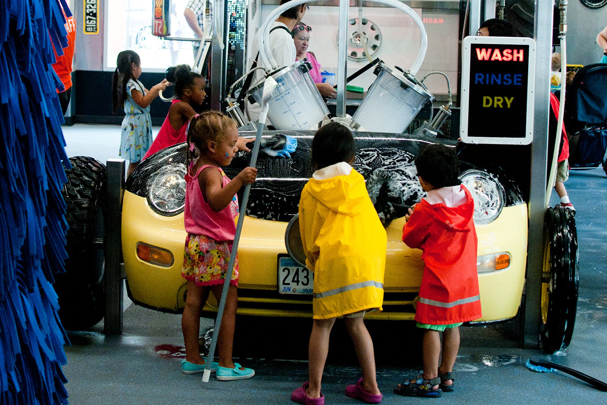 children playing with a play carwash